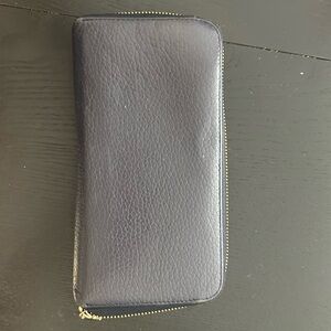 Navy blue leather wallet with bronze color accessories